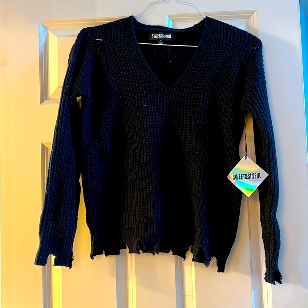 Black, distressed sweater, brand new, never worn.